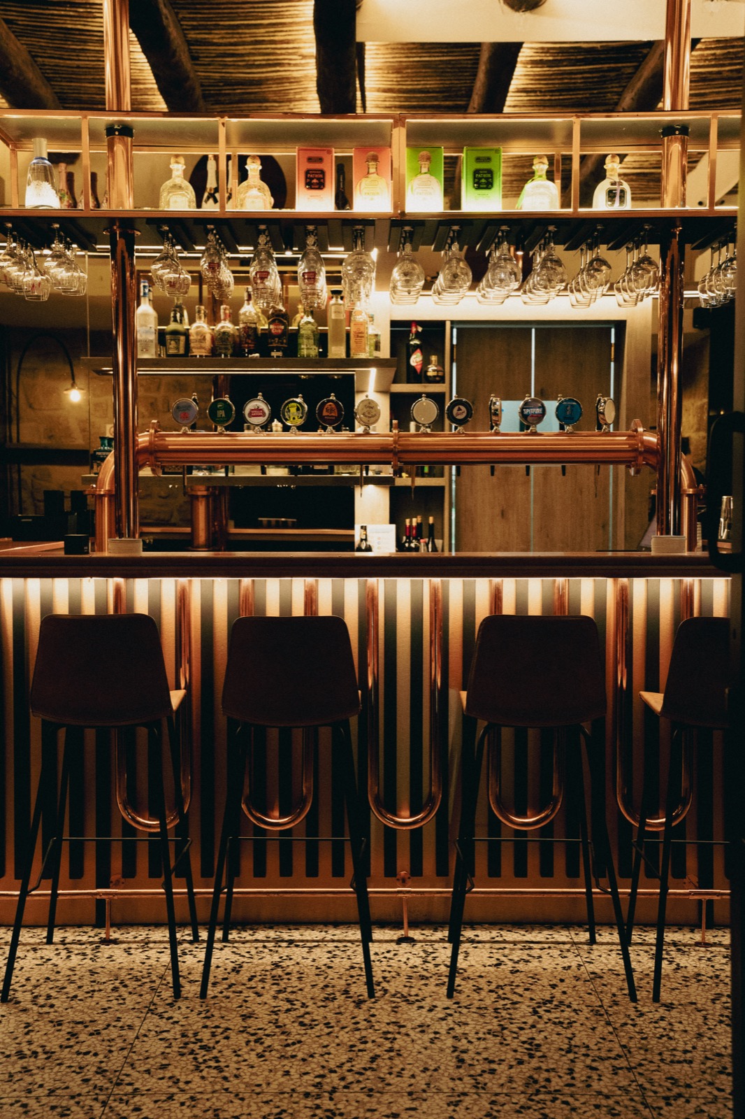 Bridge Brew Bar interior — craft beer taps, cocktail bar, and warm atmosphere in Chiaia, Naples